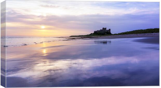 Sunrise Reflections on Bamburgh Beach  Canvas Print by Anthony McGeever