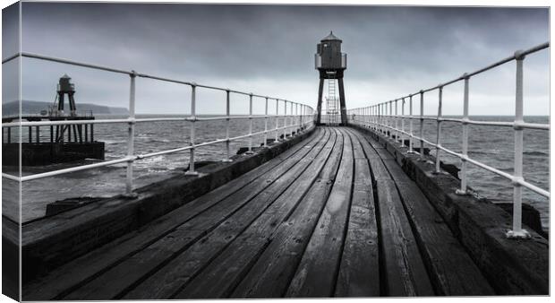 Whitby's East Pier in black and white  Canvas Print by Anthony McGeever