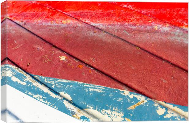 colourful painted hull of an old fishing boat Canvas Print by MallorcaScape Images