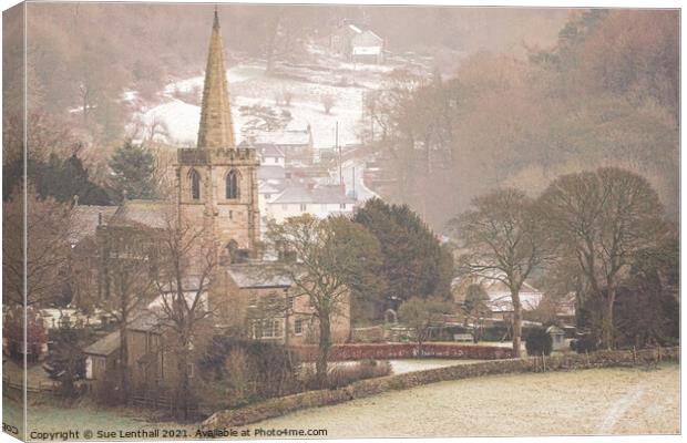 St Michael and All Angels Church with a snowy backdrop Canvas Print by Sue Lenthall
