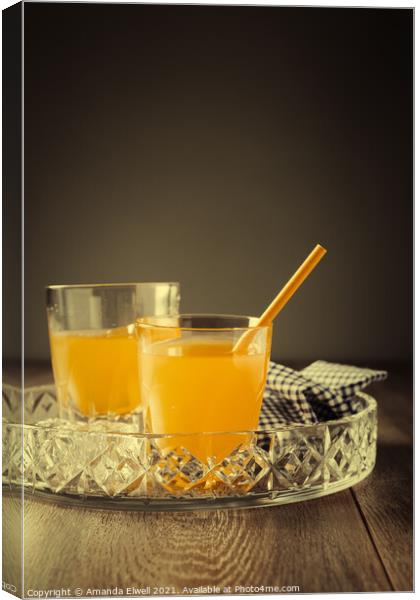 Glasses Of Orange Juice Canvas Print by Amanda Elwell