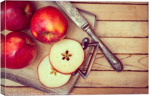 Apples On Rustic Chopping Board Canvas Print by Amanda Elwell