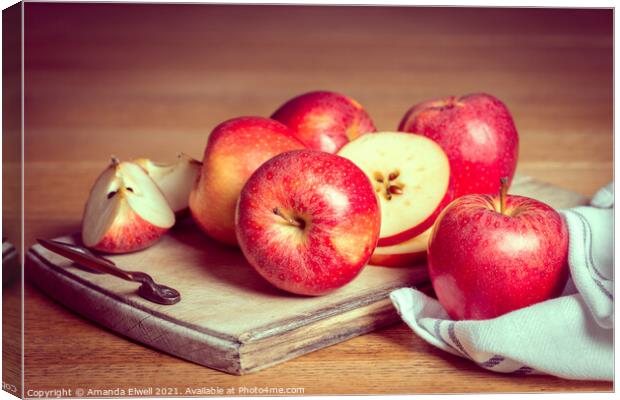 Red Apples On Rustic Chopping Board Canvas Print by Amanda Elwell