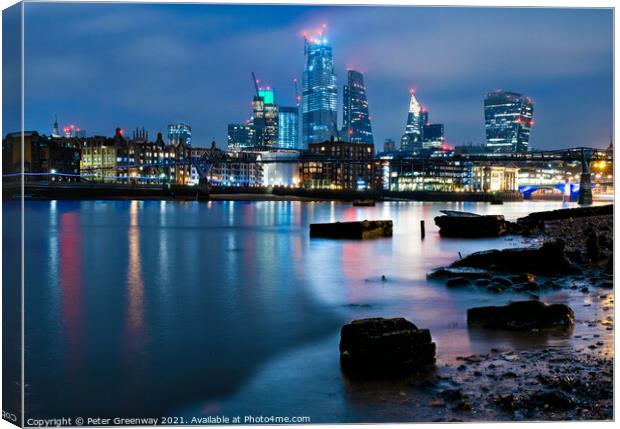 London Skyline from River Thames Shore at Nighttime Canvas Print by Peter Greenway