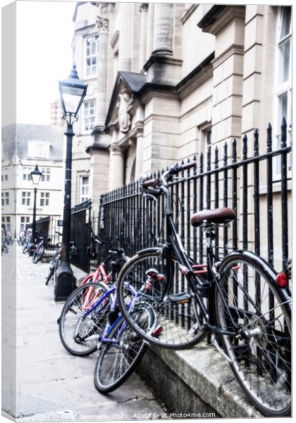 Bikes Chained Up Against Railings Outside Oxford University Coll Canvas Print by Peter Greenway