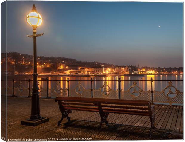 Illuminated Lamp Post And Benches On Swanage Pier Canvas Print by Peter Greenway