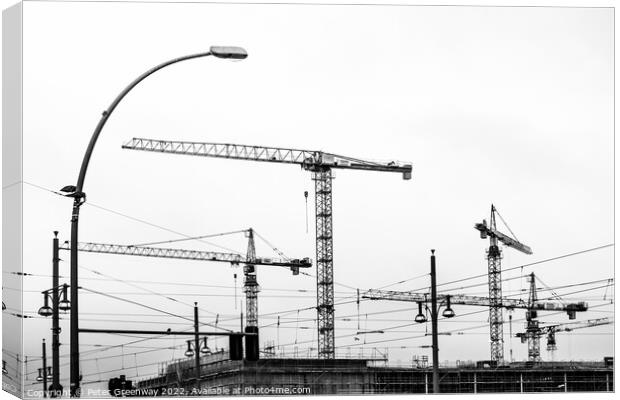 Cranes On A Building Site In Berlin Canvas Print by Peter Greenway