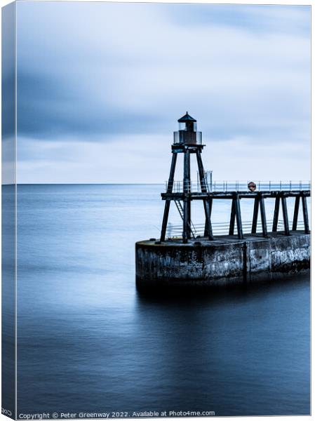 The Red Shipping Lighthouse On The East Pier At Whitby On A Cold Canvas Print by Peter Greenway