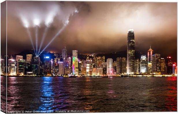 Laser Light Show Over Victoria Harbour At Tsim Sha Tsui, Hong Kong Canvas Print by Peter Greenway