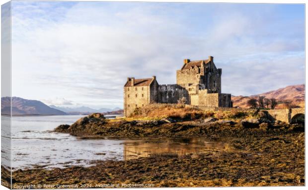 Winter Sunshine On Eilean Donan Castle in the Scotish Highlands Canvas Print by Peter Greenway