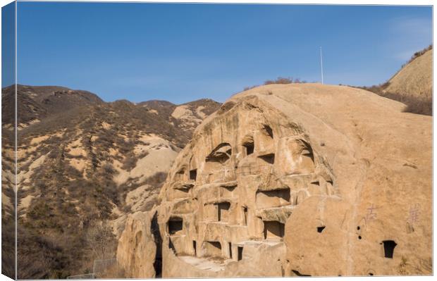 Ancient Cliff Dwellings of Guyaju Caves in China Canvas Print by Mirko Kuzmanovic
