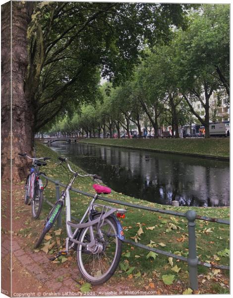 Bicycle in downtown Dusseldorf Canvas Print by Graham Lathbury