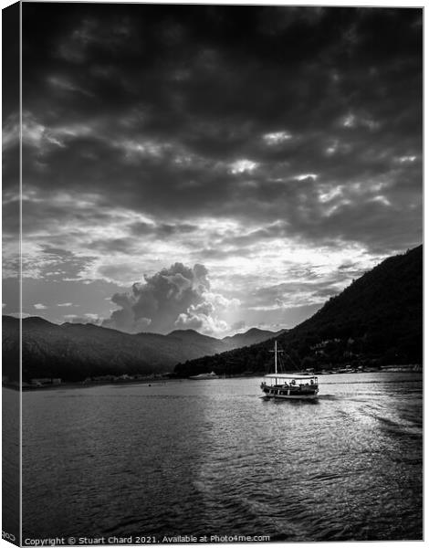 Boat and mountains at sunset - black and white Canvas Print by Stuart Chard