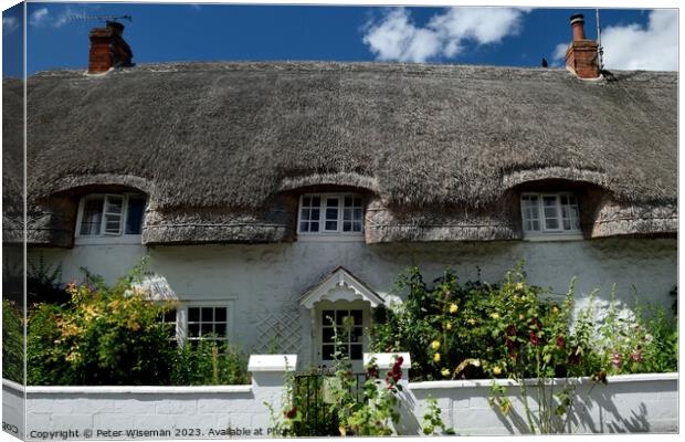  A thatched cottage  in Avebury Canvas Print by Peter Wiseman