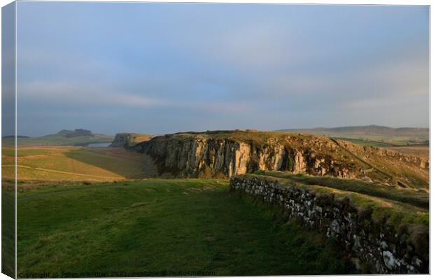 Autumn evening sun on Hadrian's Wall Canvas Print by Peter Wiseman