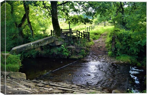Clam bridge and ford, Wycoller Country Park Canvas Print by Peter Wiseman