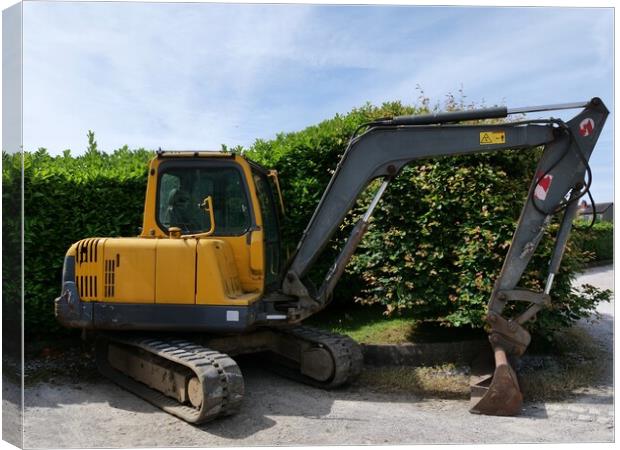 Yellow excavator digger  Canvas Print by Roy Hinchliffe