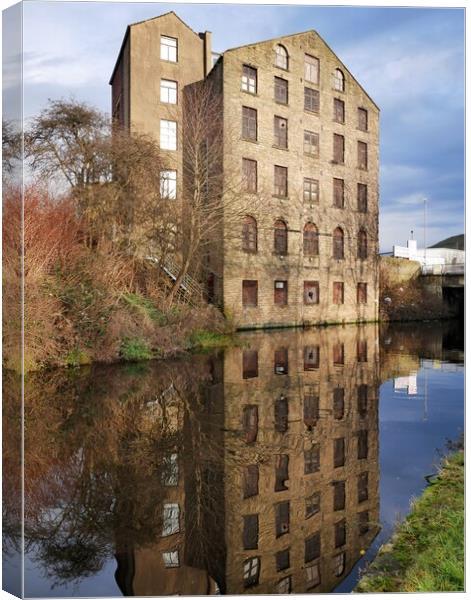 Building reflections in the Huddersfield canal Canvas Print by Roy Hinchliffe