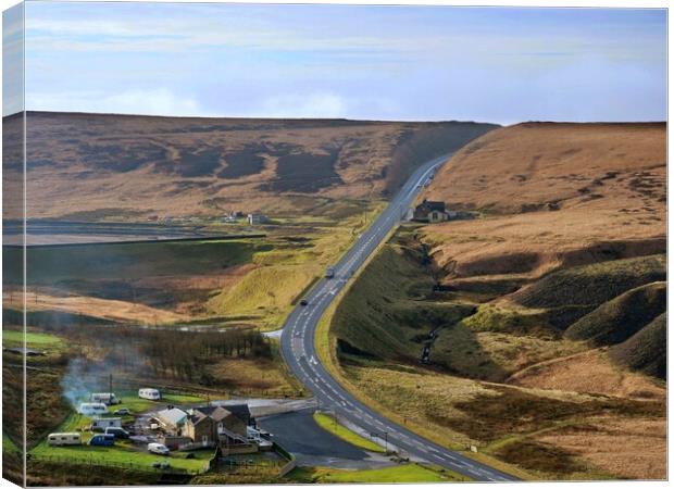Road over the moors Canvas Print by Roy Hinchliffe