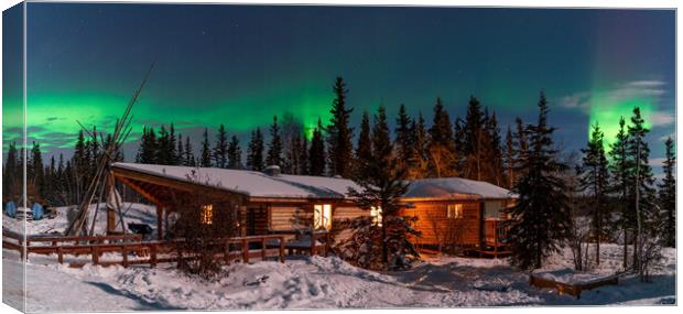 Panorama of Aurora Borealis, Northern Lights, over aboriginal wooden cabin at Yellowknife, Northwest Territories, Canada Canvas Print by Chun Ju Wu