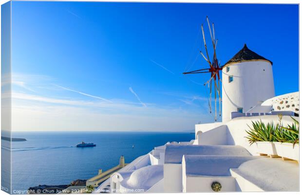 Windmill and traditional white buildings facing Aegean Sea in Oia, Santorini, Greece Canvas Print by Chun Ju Wu