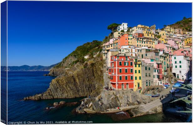 Riomaggiore, one of the five Mediterranean villages in Cinque Terre, Italy, famous for its colorful houses Canvas Print by Chun Ju Wu