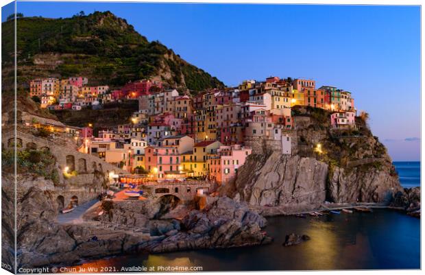 Sunset and night view of Manarola, one of the five Mediterranean villages in Cinque Terre, Italy, famous for its colorful houses and harbor Canvas Print by Chun Ju Wu