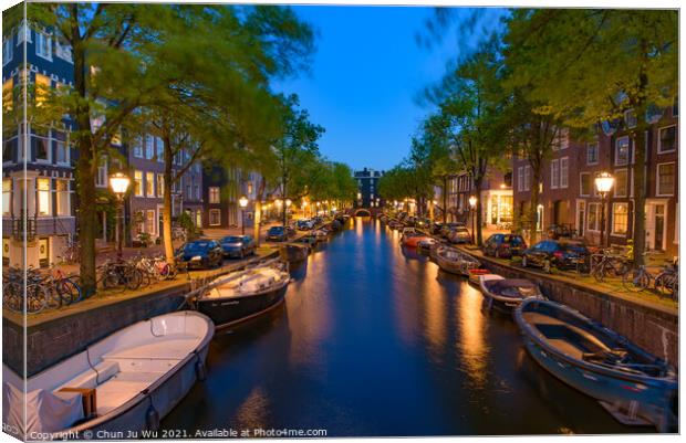 Night view of buildings and boats along the canal in Amsterdam, Netherlands Canvas Print by Chun Ju Wu