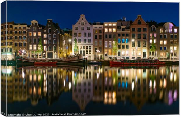 Reflection of the buildings along the canal at night in Amsterdam, Netherlands Canvas Print by Chun Ju Wu