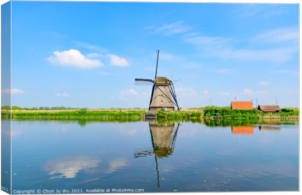 The windmills and the reflection on water in Kinderdijk, a UNESCO World Heritage site in Rotterdam, Netherlands Canvas Print by Chun Ju Wu