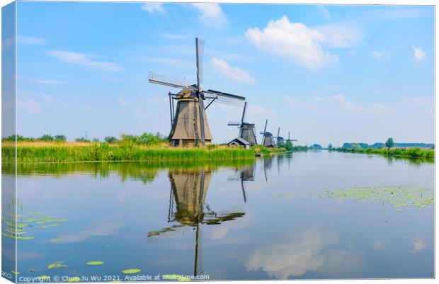 The windmills and the reflection on water in Kinderdijk, a UNESCO World Heritage site in Rotterdam, Netherlands Canvas Print by Chun Ju Wu