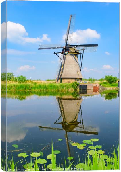 The windmills and the reflection on water in Kinderdijk, a UNESCO World Heritage site in Rotterdam, Netherlands Canvas Print by Chun Ju Wu