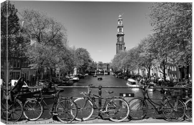Bikes on the bridge that crosses the canal in Amsterdam, Netherlands (black & white) Canvas Print by Chun Ju Wu