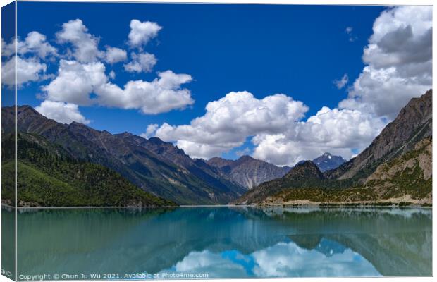 Mountains and reflection on lake with clouds Canvas Print by Chun Ju Wu