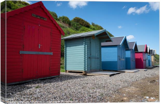 Colourful Norfolk Beach Huts Canvas Print by Roger Worrall