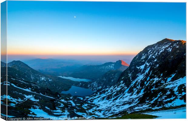 Snowdon horseshoe under a rising moon Canvas Print by John Henderson