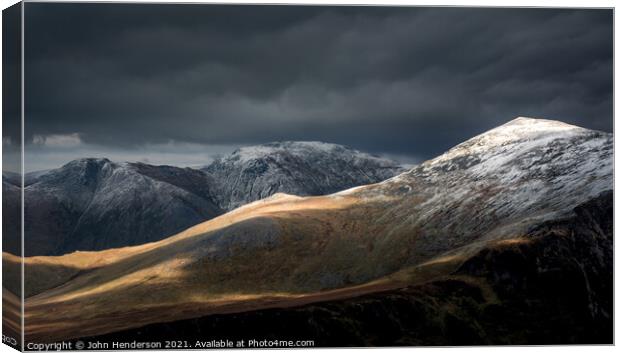 Winter on the Carneddau mountains of Snowdonia Canvas Print by John Henderson