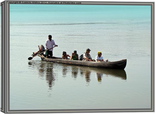 Tourists in a Log Boat Canvas Print by Susmita Mishra