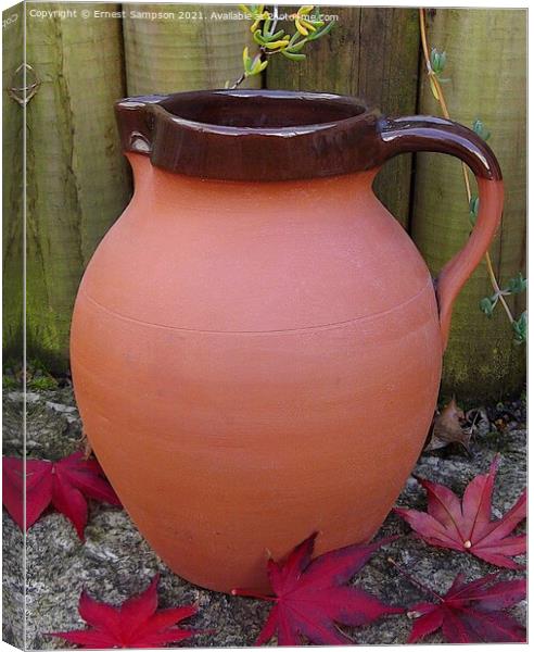 Large Studio Pottery Jug Surrounded By Acer leaves Canvas Print by Ernest Sampson