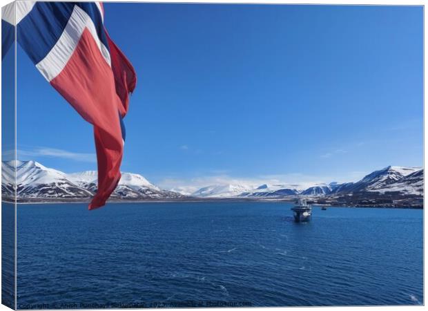 Norwegian Winter: Majestic Mountain Flag in Blue Sky a view from svalbard and jan mayen Canvas Print by Anish Punchayil Sukumaran