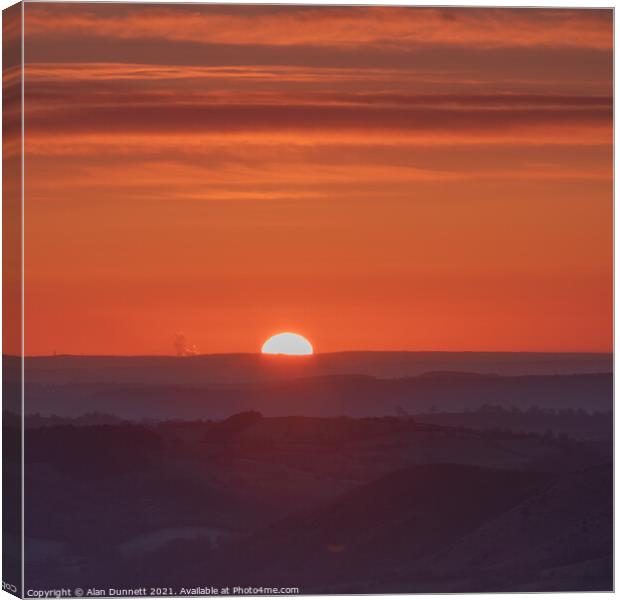 Rising sun over the Shropshire Hills Canvas Print by Alan Dunnett