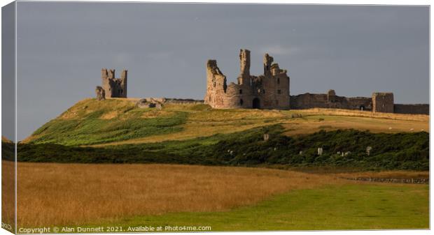 Dunstanburgh Castle Canvas Print by Alan Dunnett