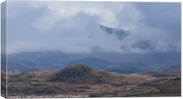 Behind the cloud Canvas Print by Alan Dunnett