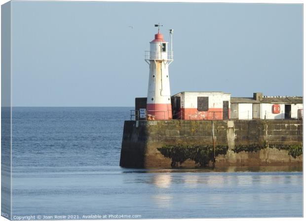 Newlyn lighthouse on a clear day Canvas Print by Joan Rosie