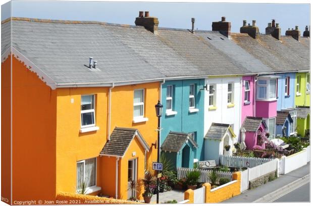 Row of brightly coloured houses in a street in Westward Ho! Canvas Print by Joan Rosie