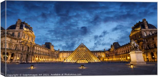Louvre museum pyramid in Paris, panorama at night Canvas Print by Delphimages Art