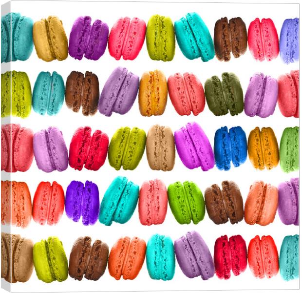 Rows of brightly colored French macarons cookies Canvas Print by Delphimages Art