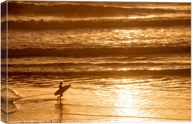 Silhouette of a surfer at sunset in the ocean Canvas Print by Delphimages Art