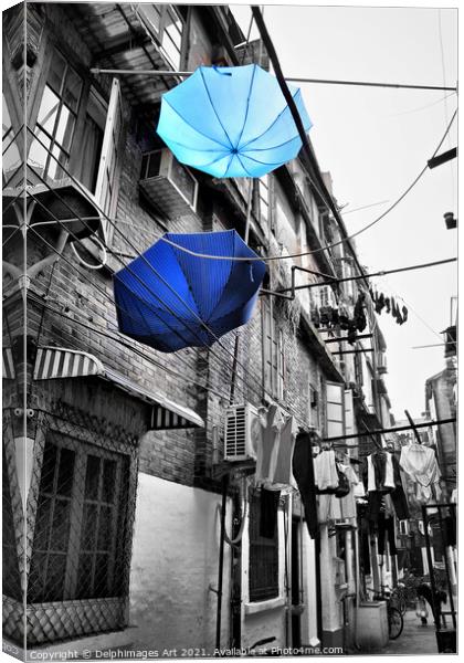 Shanghai, China. Umbrellas in a street after the r Canvas Print by Delphimages Art
