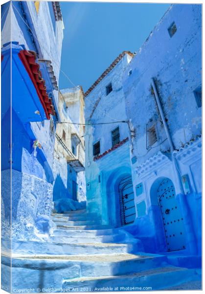 Street in the blue city of Chefchaouen in Morocco Canvas Print by Delphimages Art